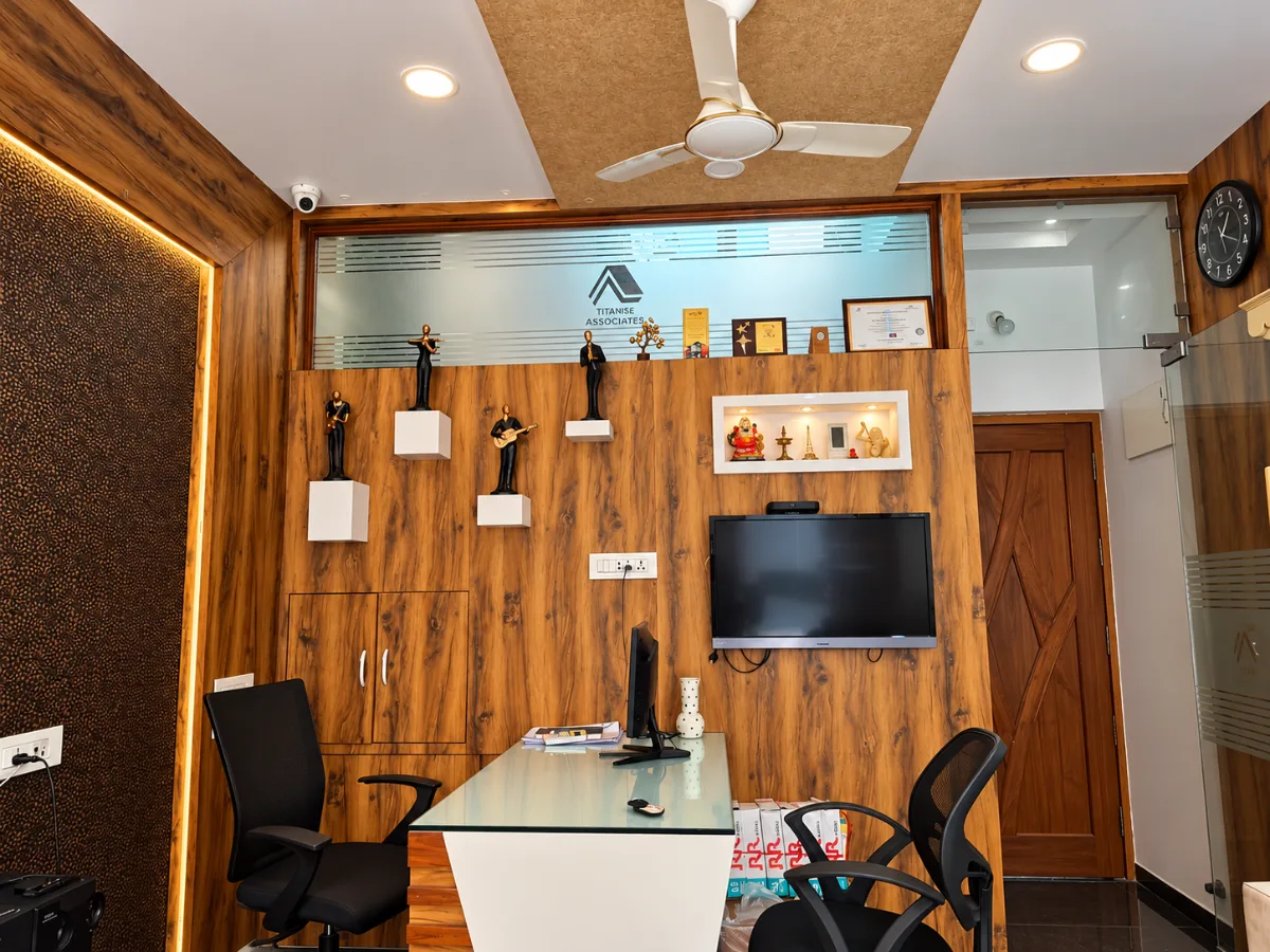 The principal’s cabin, with a walnut feature wall, figurines and awards
